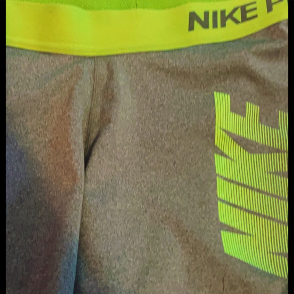 Gray and green Nike pros